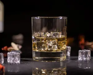 Glass of whiskey with ice